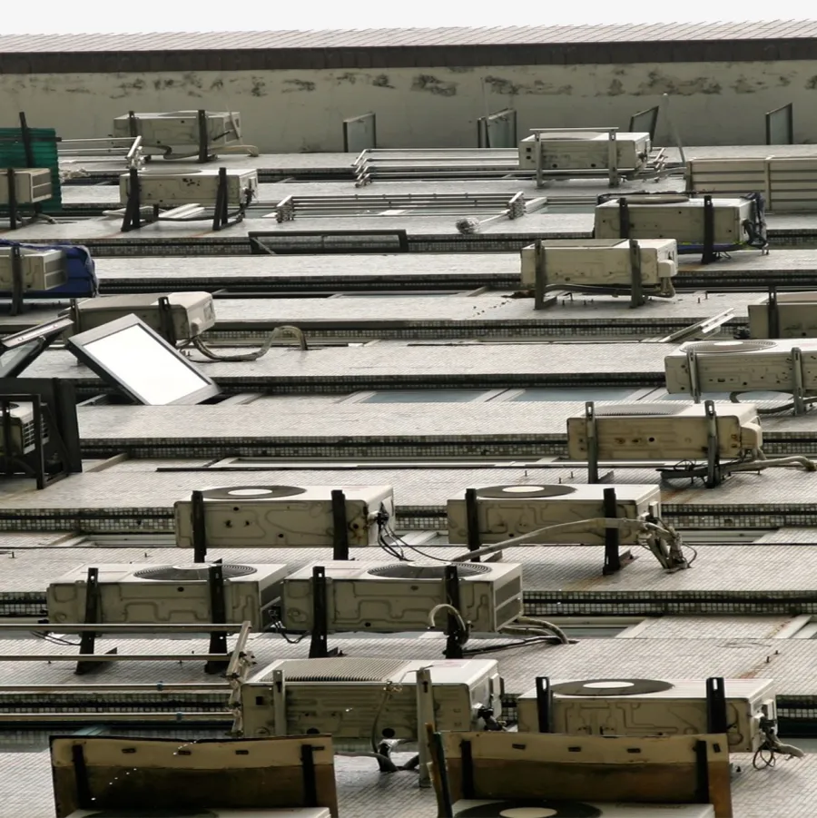 Rows of air conditioning units on a flat roof